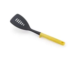 Non-stick safe slotted turner in light yellow with tool rest by Joseph Joseph