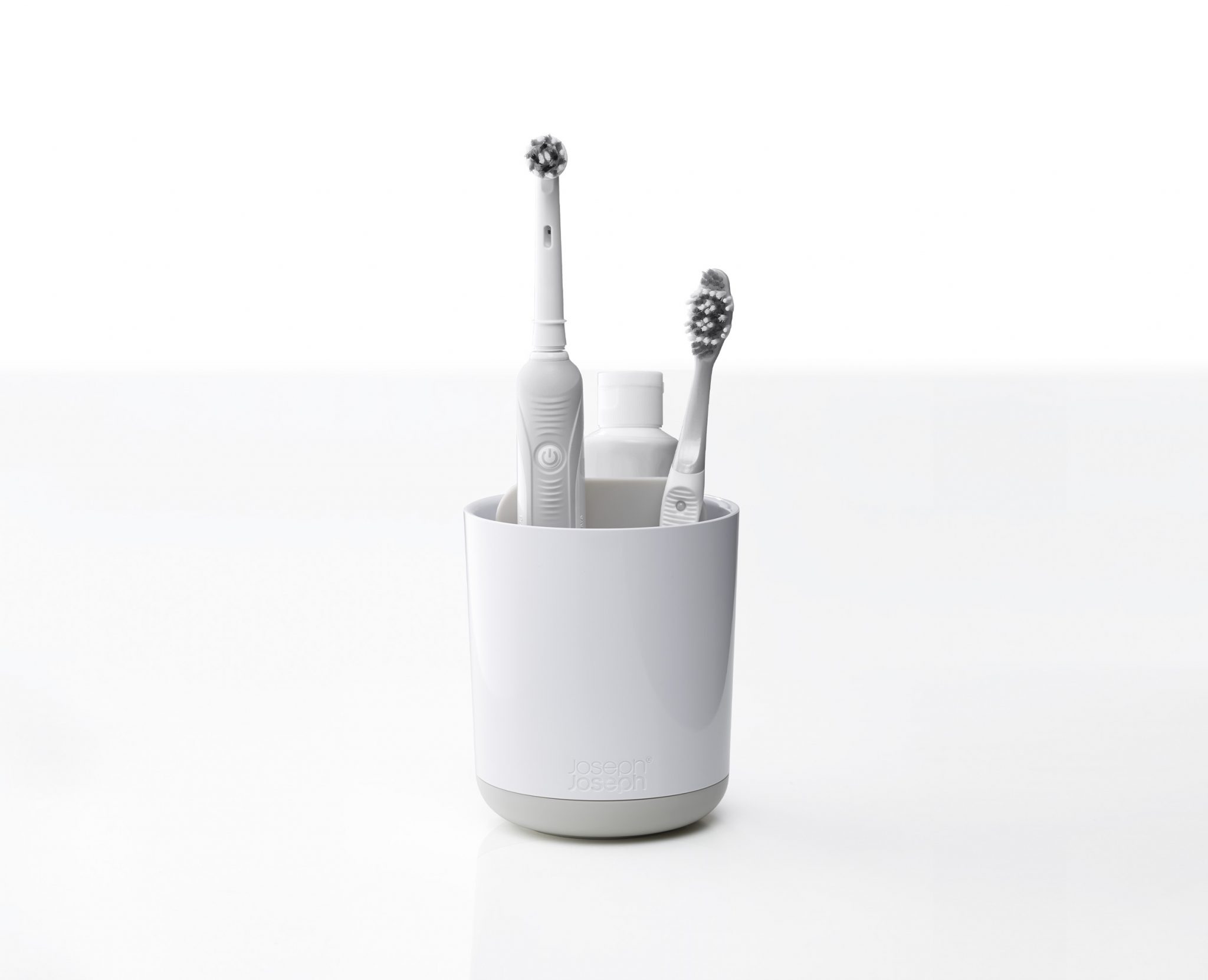 White toothbrush holder with ventilation holes and compartments by Joseph Joseph